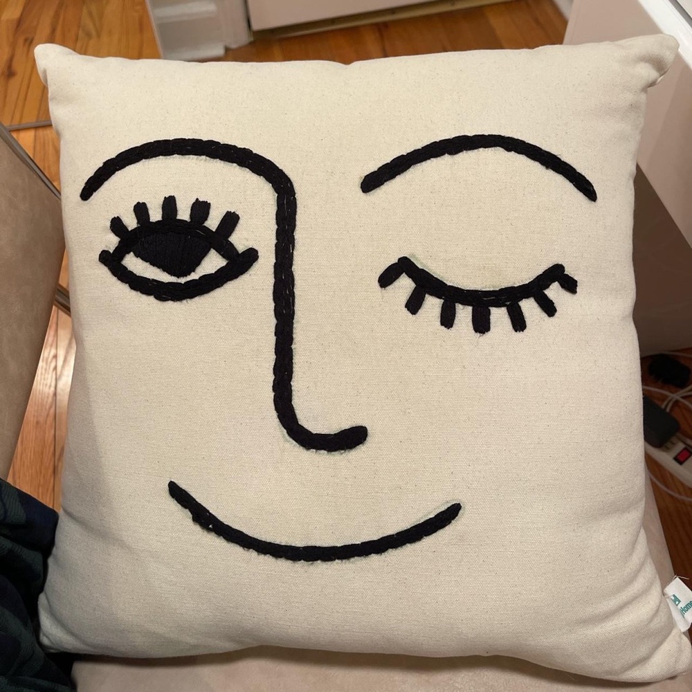 Urban Outfitters wink pillow
